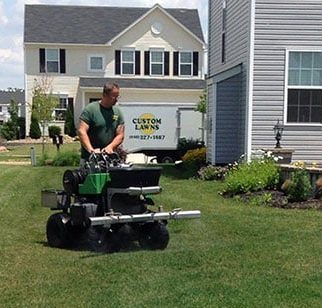 Man seeding backyard